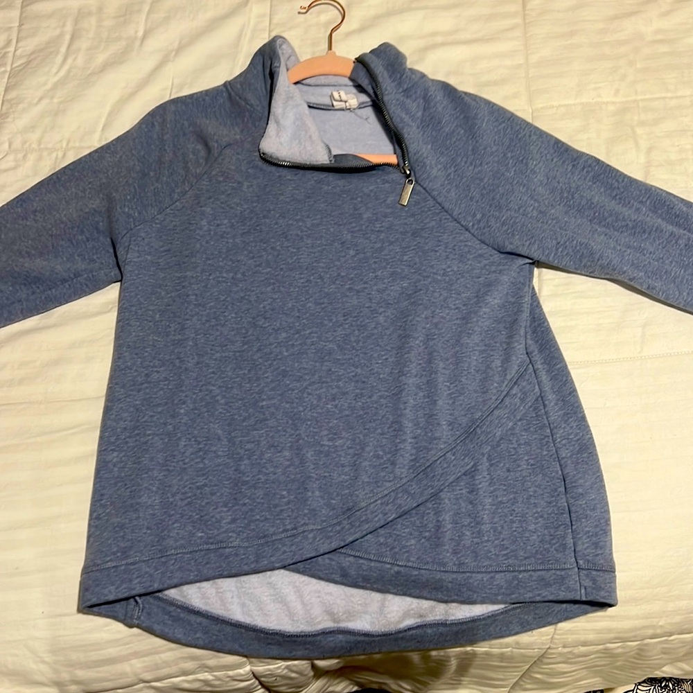 blue sweater, cables and gauge size Medium.